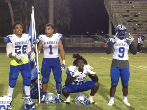 Trevor James (22), Keirston Johnson (1), Dequan Jackson (10) and Noah Jackson (9) pose after the game 