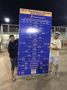 Oakleaf coaches Christina and Robbie Thompson hold up the bracket after winning the prestigious Kissimmee Klassic. 